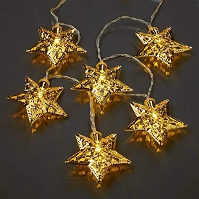 Immagine di Hellum Catena luminosa a LED con stelle in metallo dorate, 10 bianco caldo, lunghezza 135 cm, timer, per interni, funzionamento batteria (3AA) 522426