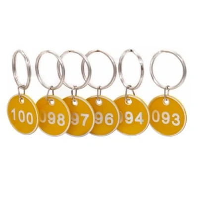 Immagine di NanTun Targhette numerate in alluminio con portachiavi, confezione da 100, numeri 1 a giallo