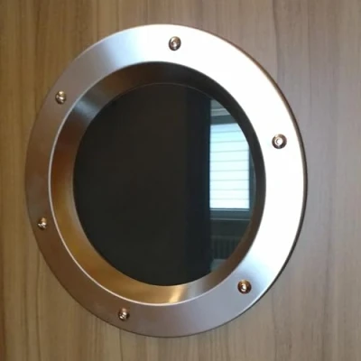 Immagine di Oblò in acciaio inossidabile INOX rettificato per porte, diametro 350mm, vetro trasparente, dadi a colletto.