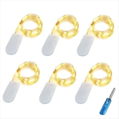 Immagine di BXROIU 6 x 20 LED Stringa Luci a Batteria CR2032 (includere), Ghirlanda in Filo d&#039;Argento da 2 Metri, Catena Luminosa Ideale per Feste, Matrimoni e Decorazioni Natalizie (bianco caldo)