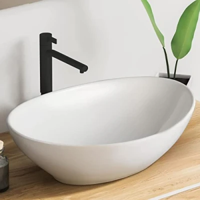 Immagine di VMbathrooms Premium Lavabo ovale con effetto loto da appoggio per bagno e WC ospiti senza foro rubinetto troppopieno bianco puro