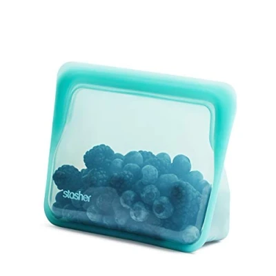 Immagine di Stasher Borsa portaoggetti riutilizzabile in silicone per uso alimentare, color acqua (mini stand up min), riduce la plastica monouso, cucinare, conservare, conservare o congelare, a prova di