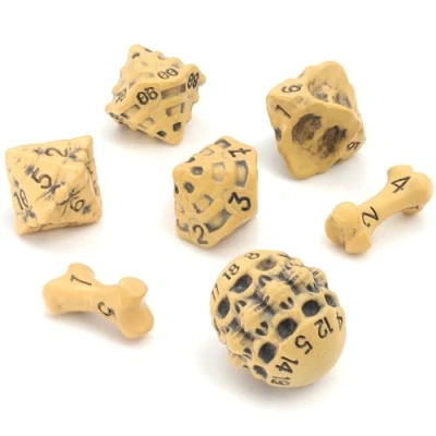 Immagine di Set Dadi D&amp;D di 7 Poliedrici Teschio e Ossa per GDR/RPG D20, D12,%D10, D10, D8, D6 &amp; D4. DND Dice Set/Dadi Particolari Warhammer, Pathfinder, Dungeons Dragons Gadget (Giallo)