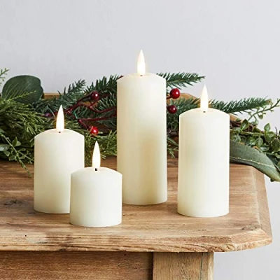 Immagine di Lights4fun TruGlow® Set di 4 candele a LED in vera cera con telecomando e timer, funzionamento batteria