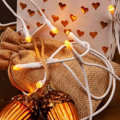 Immagine di hellum 100 pezzi mini luci LED da fata con spina e cavo bianco, per interni bianco caldo, lunghezza illuminata 14,85 m &lt; 59 lm 151671