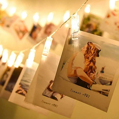 Immagine di MODOAO Led Photo Lights Pegs e String 20 Fata Clips 3M / 9.8FT batteria interna, Hanging Frames Decorazioni per camera da letto Wedding Party, 3 * AA Alimentato a