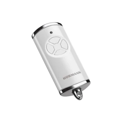 Immagine di Hörmann Trasmettitore Manuale HSE 4 BS (frequenza 868 MHz, Bianco Lucido, azionamento Porta Garage con Tappi cromati, batterie Incluse, Dimensioni 28 x 70 14 mm, Anello Portachiavi) 4511565