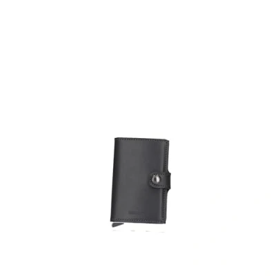 Immagine di Secrid Il MiniWallet presenta delle dimensioni compatte, ma ha una capacità sorprendente. rivestimento in pelle esterno può contenere banconote, scontrini e tessere, mentre nel Cardprotector all