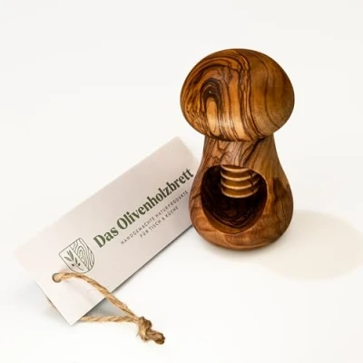 Immagine di das Olivenholzbrett® / Schiaccianoci con filettatura a vite in legno d&#039;ulivo forma di fungo/Schiaccianoci