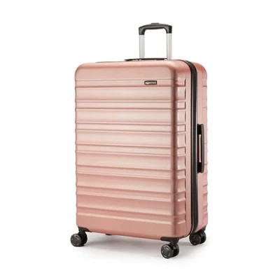 Immagine di Amazon Basics Valigia Rigida Grande (78 cm), Guscio in ABS Antigraffio, Espandibile, 4 Ruote Girevoli, Oro Rosa
