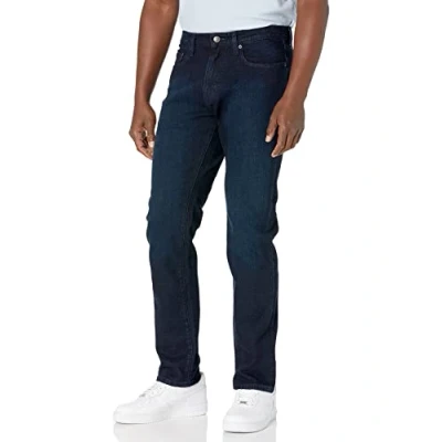 Immagine di Amazon Essentials Jeans Elasticizzati con vestibilità Sportiva Uomo, Blu Sovratinto, 36W / 34L