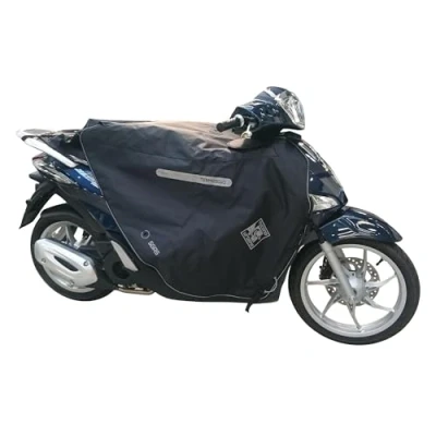 Immagine di Tucano Urbano coprigambe per scooter Termoscud® R184. L&#039;originale termoscudo con brevetto anti sventolio S.G.A.S. Costruzione triplo strato HYDROSCUD a tenuta stagna. Termico. Certificato CE