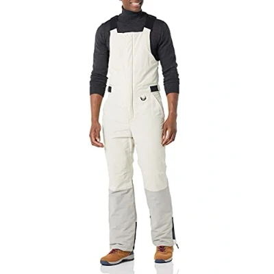 Immagine di Amazon Essentials Salopette da Neve Isolata Impermeabile Uomo, Avorio Grigio Color Block, S