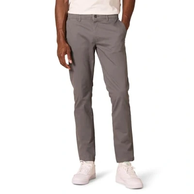 Immagine di Amazon Essentials Chino Elasticizzati Comodi Slavati Skinny (in precedenza Goodthreads) Uomo, Grigio, 32W / 34L