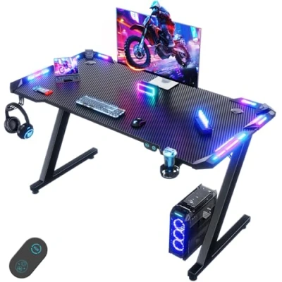 Immagine di Devoko 120 x 60cm Scrivania Gaming LED, Tavolo Ergonomica, per Computer con Porta Bicchiere e Ganci Cuffie, Postazione Piano del in Fibra di Carbonio, Nero
