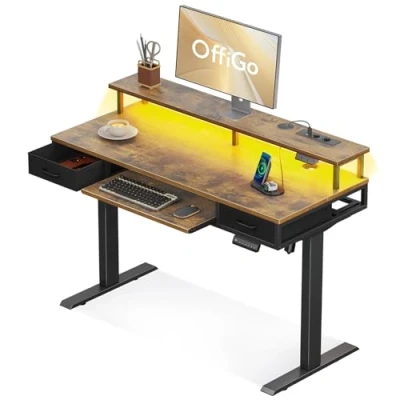 Immagine di OffiGo Scrivania Elettrica con Cassetti, 120cm Regolabile in Altezza Supporto per Monitor, Vassoio Tastiera, Ufficio Prese e LED Luce, Marrone