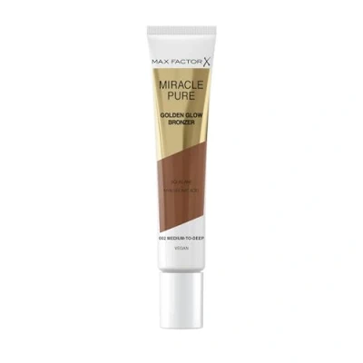 Immagine di Max Factor Miracle Pure Golden Glow Bronzer, Medium to Deep, Terra in Crema, Formula Cremosa e Vegana, Squalane &amp; Acido Ialuronico, 15ml