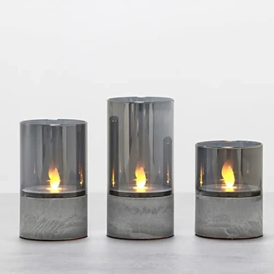 Immagine di Fanna 3 Grigio Fumo Candele LED Fiamma Oscillante con Timer, Lanterne in Vetro per Natale Decorazione Uso Interno H 10 cm / 12,5 15