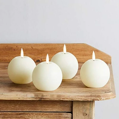 Immagine di Lights4fun Set di 4 Candele Sferiche TruGlow® in Cera Avorio a Pile con LED Bianco Caldo per Interni