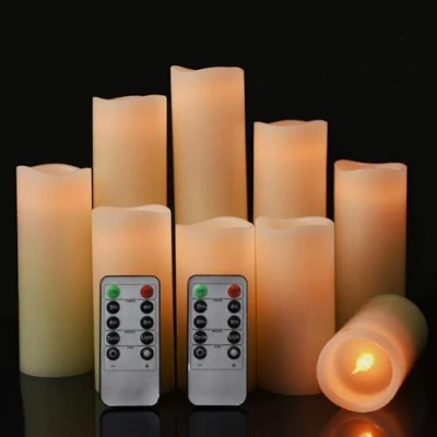 Immagine di Set di 9 candele a LED, senza fiamma, funzionamento batteria, diametro 5,5 cm x altezza 10/12,5/15/17,5/20/22,8 cm, in vera cera con telecomando e funzione timer 24 ore (avorio)