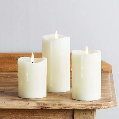 Immagine di Lights4fun Set di 3 Candele TruGlow® ad Effetto Cera Colante con LED Bianco Caldo a Pile per Uso in Interni