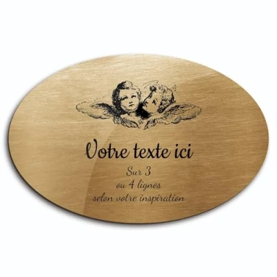 Immagine di Targhetta con scritta &quot;Due teste d&#039;angelo&quot; autoadesiva, modello ovale (20 x 13 cm) personalizzata da 1 a 3 righe, oro spazzolato