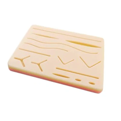 Immagine di GIMA Pad per Esercitazione Suture con Rete, Cuscino in Silicone, Simile alla pelle vera, Simulatore Suture, 3 Strati, 14 Ferite.