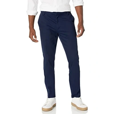 Immagine di Amazon Essentials Pantaloni chino aderenti elasticizzati con parte piatta sul davanti resistenti alle pieghe Uomo, Blu Marino, 36W / 34L