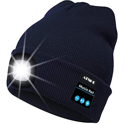 Immagine di ATNKE Berretto Bluetooth con LED Illuminato, USB Ricaricabile Wireless Musicale Cappello da Corsa Ultra Bright 4 Impermeabile Lampada Uso per Sci Escursionismo Campeggio Ciclismo (Blu Navy)