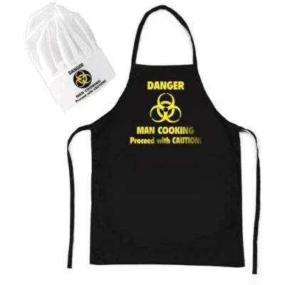 Immagine di CKB LTD grembiule da cucina con scritta &quot;Danger Man&quot;, e cappello, set regalo uomo, Nero , Taglia unica
