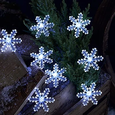 Immagine di Lights4fun Catena Luminosa di 20 Fiocchi Neve Natale a Pile con LED Bianchi per Uso in Interni