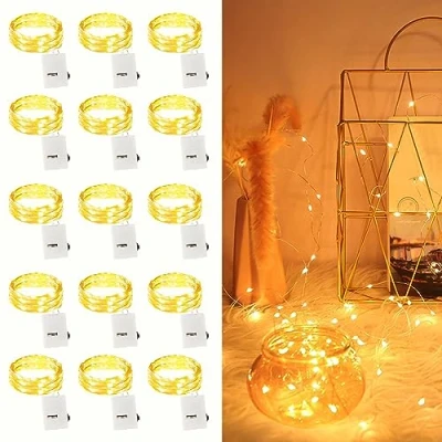 Immagine di 15 pezzi LED Stringa Luci a Batteria, 2M 20 Rame filo Ghirlanda Catena Luminose Lucine Fata per Natale Matrimonio Decorative Festa Interno Natalizie letto Camera (Bianco Caldo)