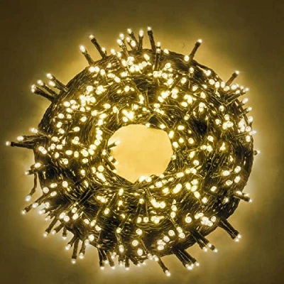 Immagine di Luccika stringa natalizia con luci a led su cavo verde per uso interno ed esterno controller 31V 8 giochi di luce e memoria (Bianco Caldo, 5 Metri 100 Led)