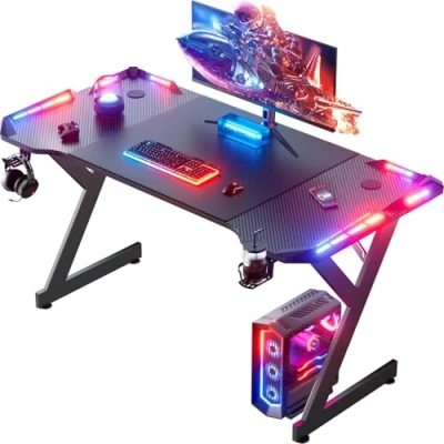 Immagine di HLONONE tavolo da gioco con LED, scrivania gioco, 160 x 60 cm, stabile per computer rivestimento in fibra di carbonio, porta bevande e gancio cuffie, nero