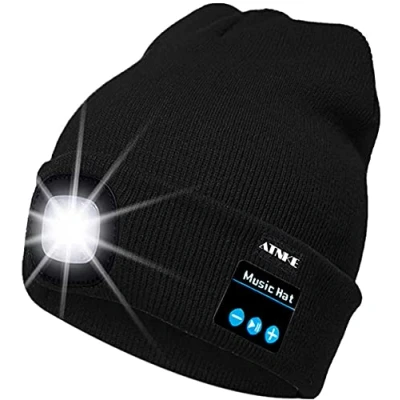 Immagine di ATNKE Berretto Bluetooth con LED Illuminato, USB Ricaricabile Wireless Musicale Cappello da Corsa Ultra Bright 4 Impermeabile Lampada Uso per Sci Escursionismo Campeggio Ciclismo/Nero