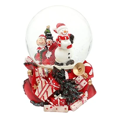 Immagine di Dekohelden24 Grande palla di neve, pupazzo neve con pinguino e gnomo, suono su base finemente decorata, dimensioni (L x P A): 10 14 cm, sfera Ø cm